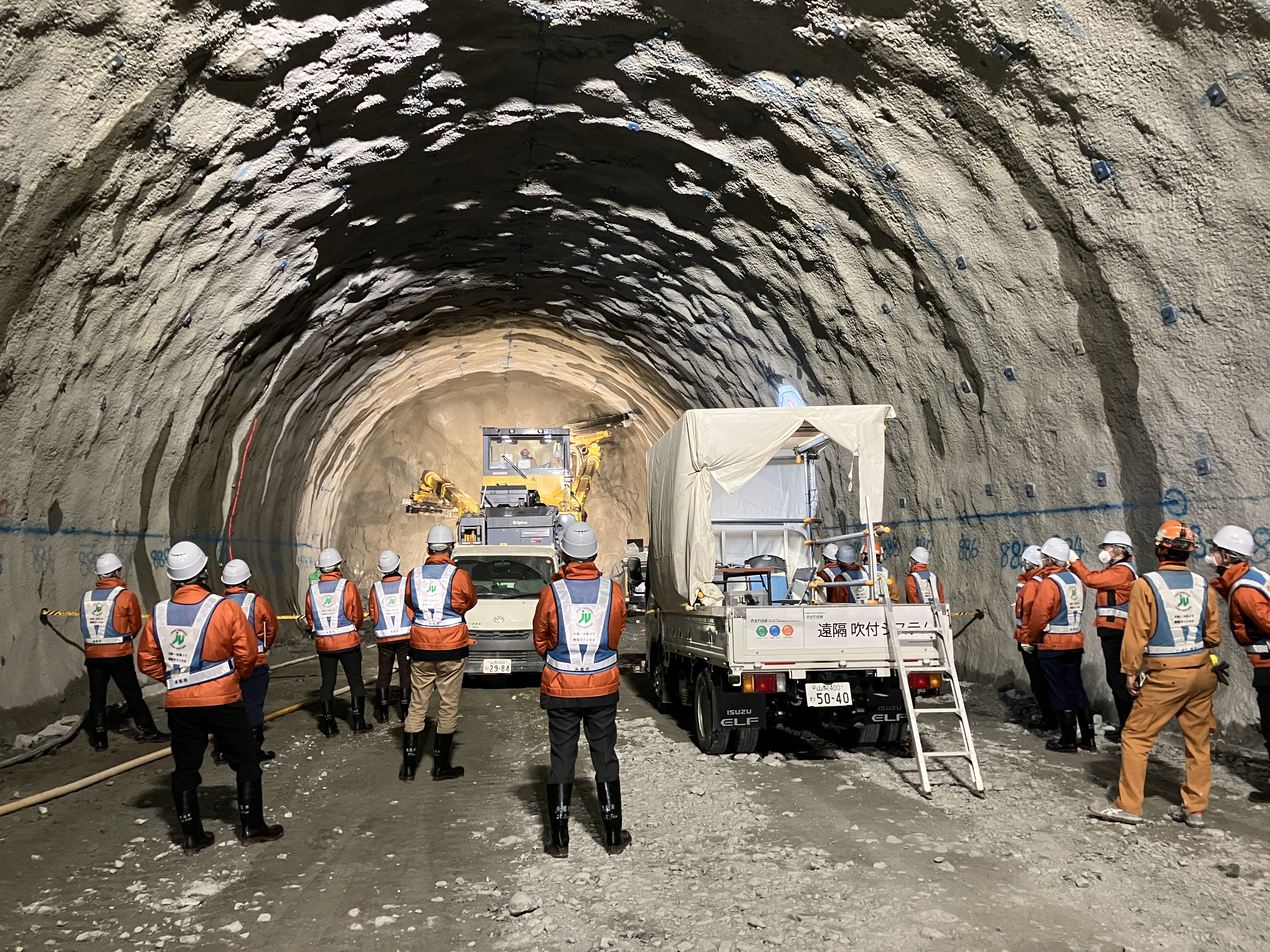 Participants observe remote-controlled drilling operations that eliminate the need for workers to enter hazardous tunnel faces